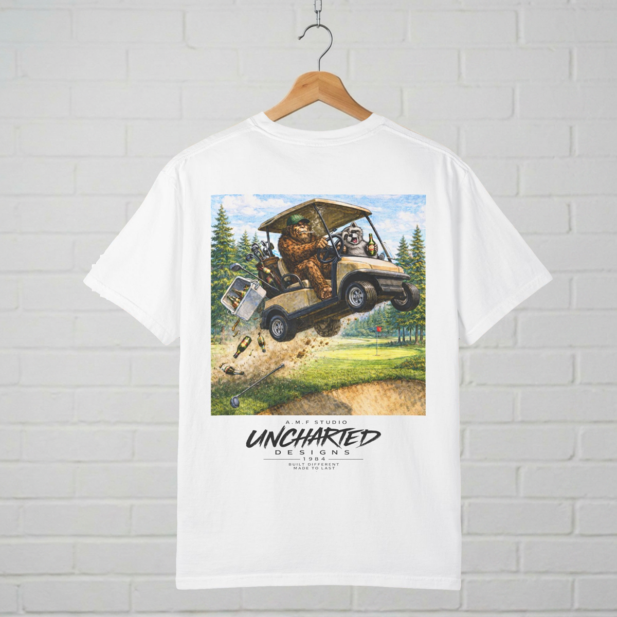 Sasquatch and Racoon Golf Cart Tee A.M.F Studio 1984
